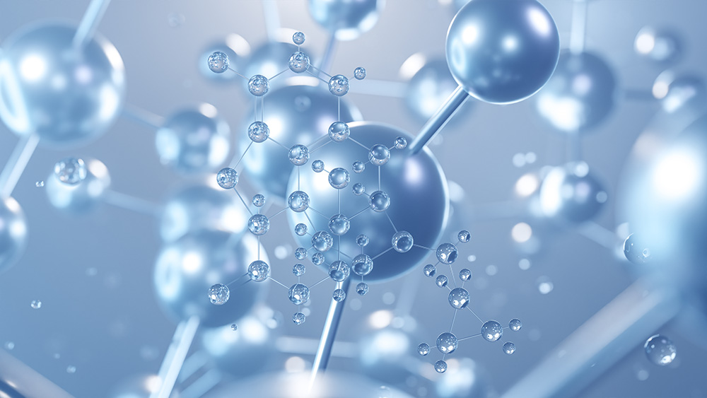 A stylized representation of molecules connected by rods, resembling an atomic structure. The image primarily features spherical shapes in varying sizes, with a metallic, reflective surface, set against a soft blue background.